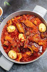 A bowl of ofada rice and stew at African Good Meal
